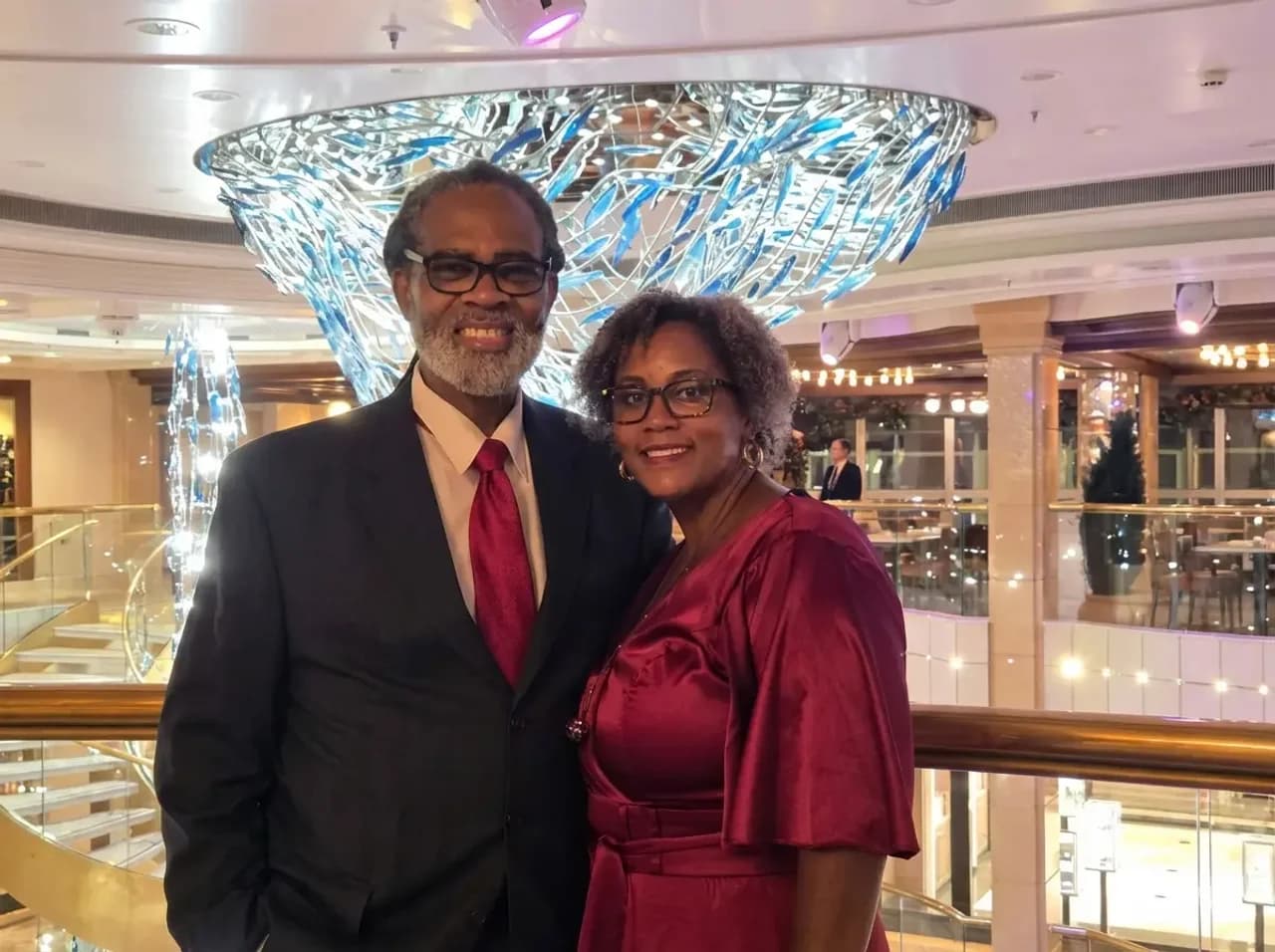 Yolanda and her partner at a formal evening aboard a cruise ship